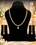 Gold Tone AD Necklace Set with Pear Drop Pendant and Matching Drop Earrings