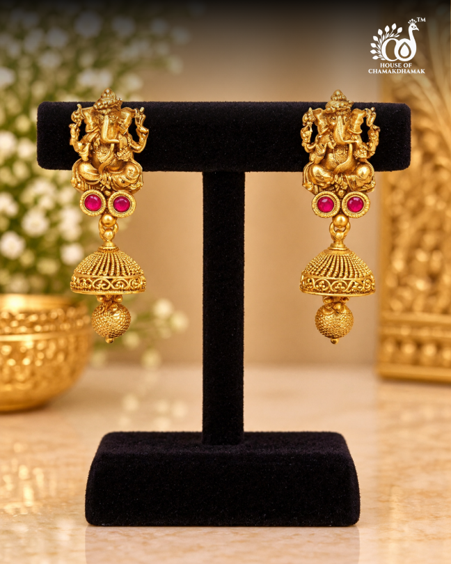Gold Tone Temple Ganesha Jhumka Earrings with Ruby Stones and Textured Bead Drop